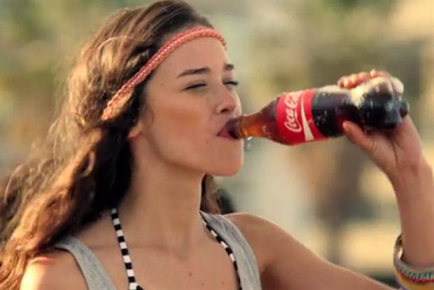 Coke pushes positivity, welcomes 2014